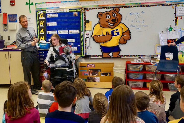 <p>Allie Gagnon getting a warm welcome from GMS Second-Grade Teacher Chad Clarey and his students.</p>
